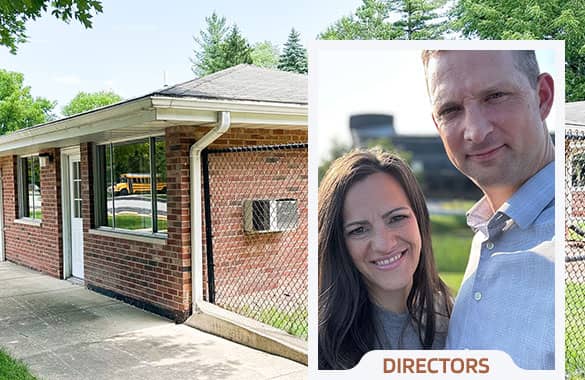 Hammond Baptist Early Learning Center Directors, Adam and Atina Merhalski, standing next to Christian preschool building in Schererville, Indiana